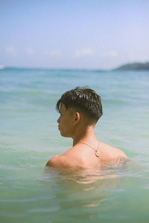 Topless Man in Body of Water