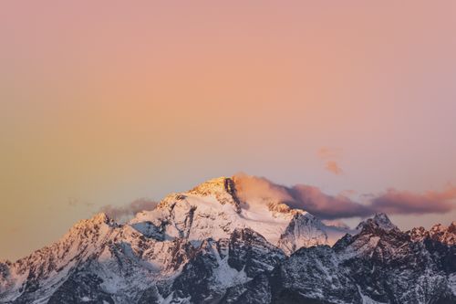 Free Breathtaking sunrise over snow-capped Alps in Lombardy, Italy, showcasing stunning mountain scenery. Stock Photo