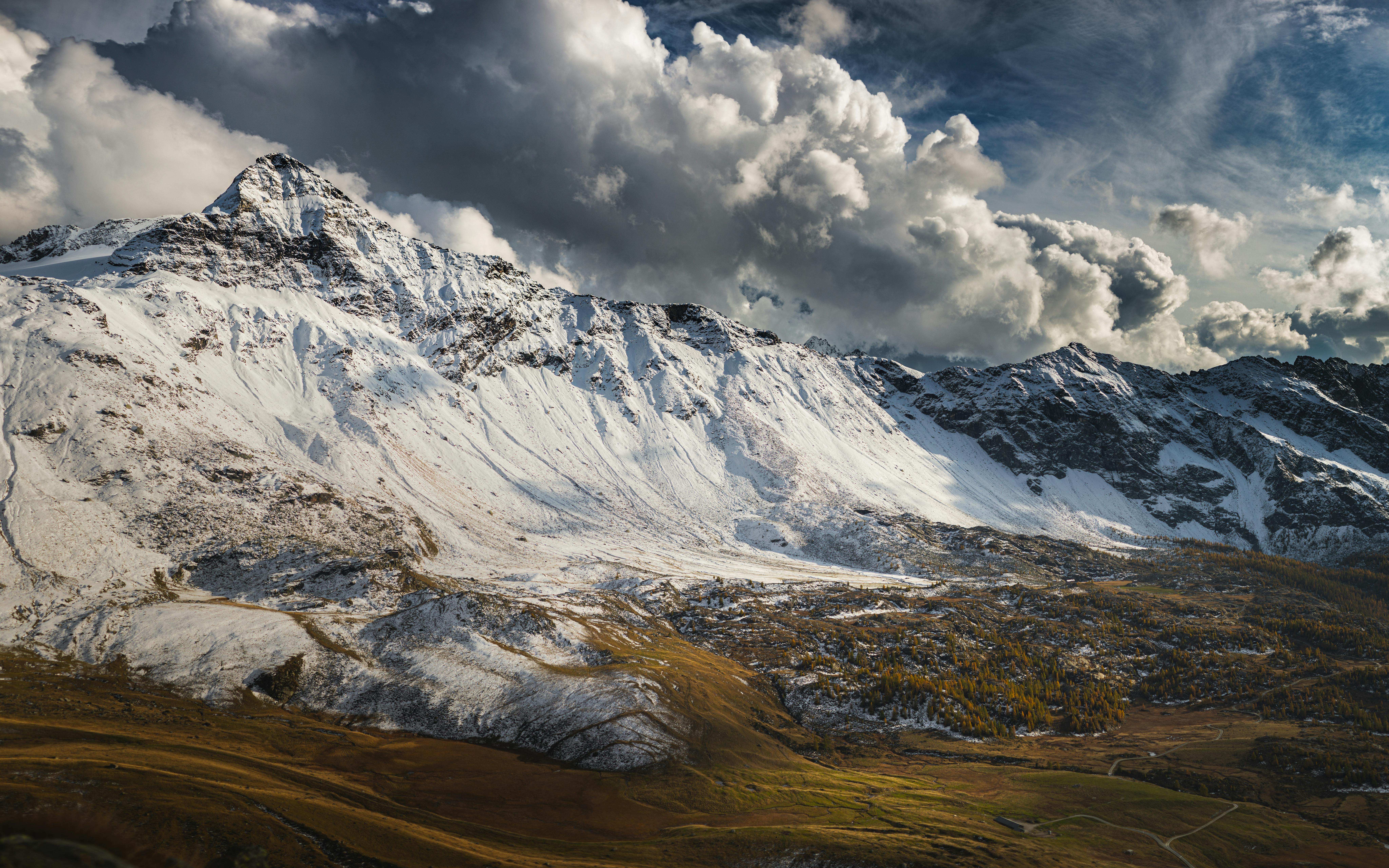 Snow Covered Mountain Under Cloudy Sky · Free Stock Photo
