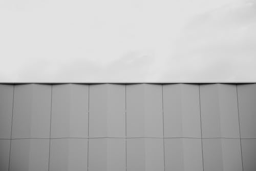 Grayscale Photo of Edge of a Building