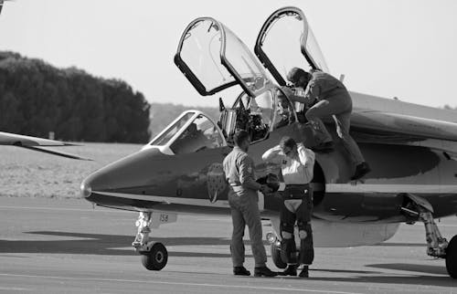 Free Pilots near Private Jet on Airdrome Stock Photo