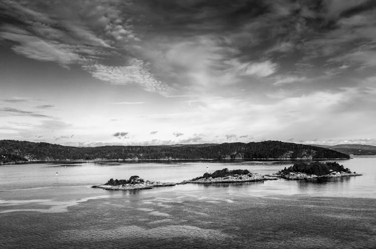 Storm Clouds Over Islands In Water