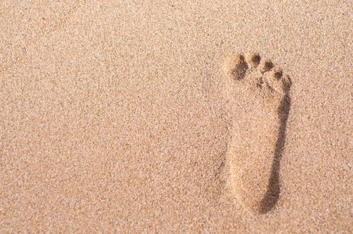 Free Foot Prints on Sand Stock Photo