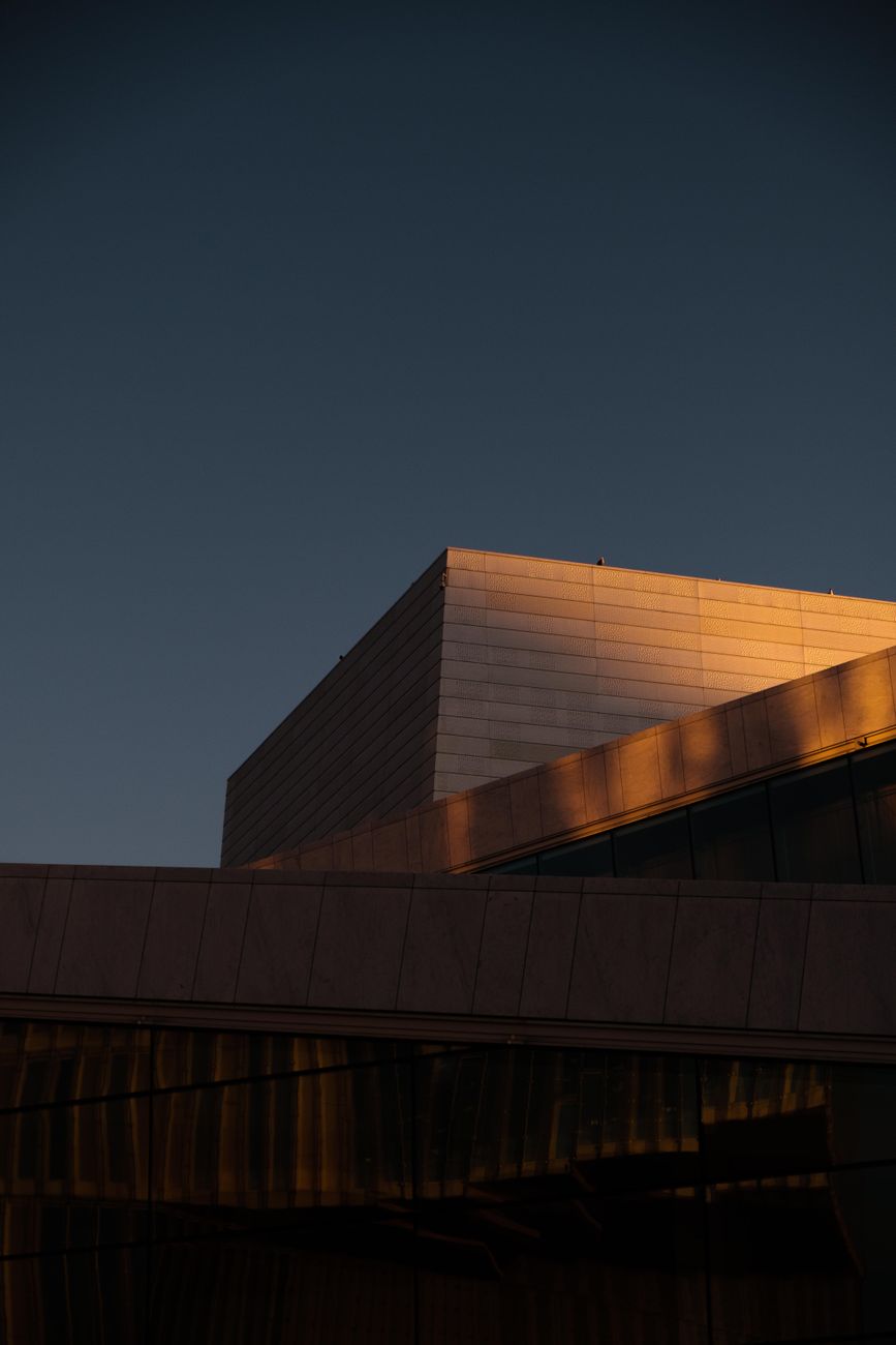 A captivating view of Oslo's modern architecture, highlighted by dawn's soft light.