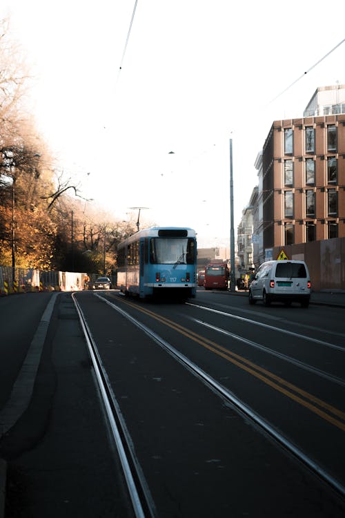 White and Blue Tram On Road