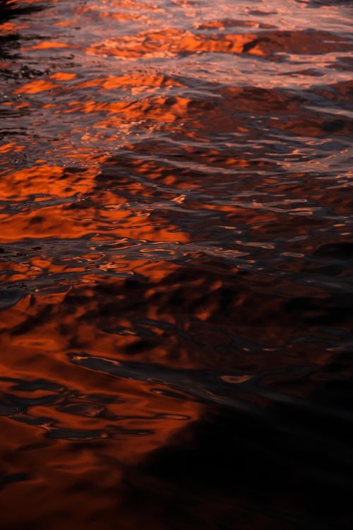 Free Captivating sunset reflections create a vibrant pattern on the waters of Oslo Fjord. Stock Photo