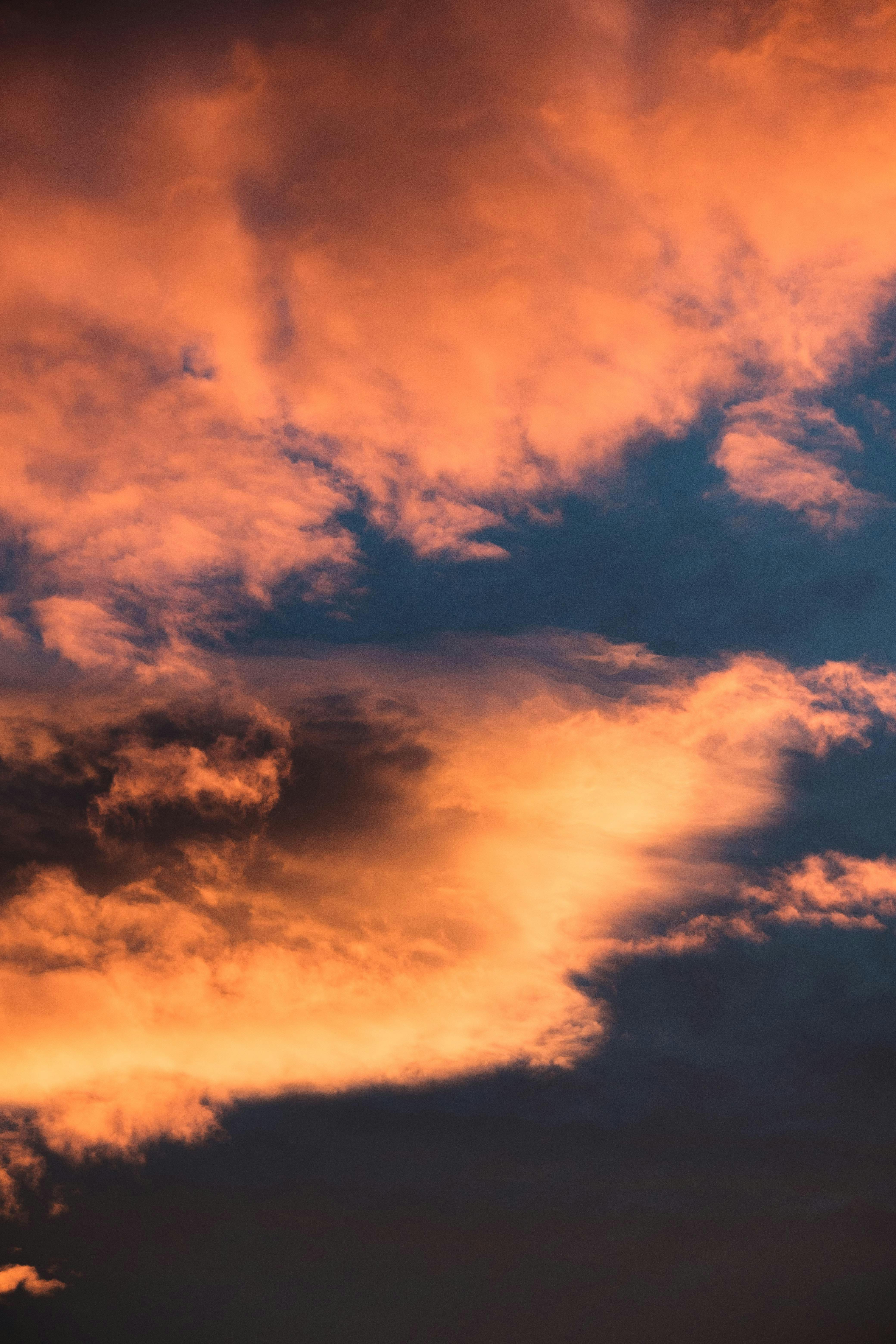 Vibrant sunset clouds over Oslo, casting dramatic hues in the sky.