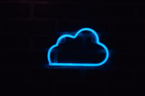 Blue Neon Sign on a Wall