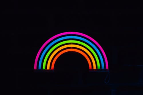 Free A Rainbow Colors on a Dark Background Stock Photo