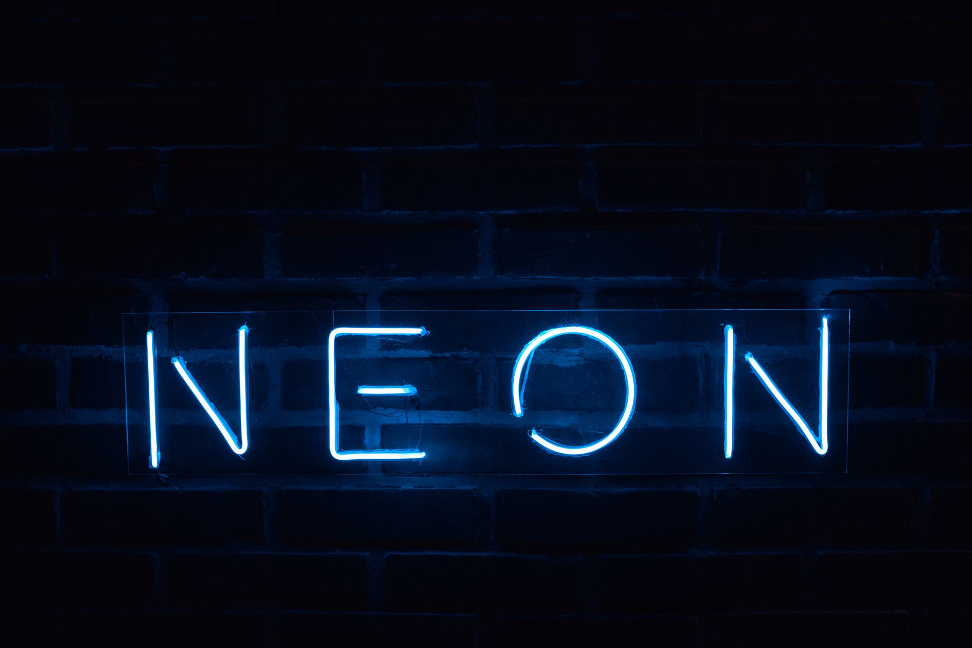 Neon Lights on a Brick Wall