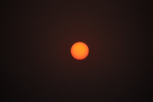 Red Sun in Black Background