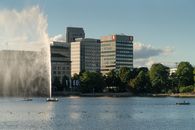 Calm river in city with fountain