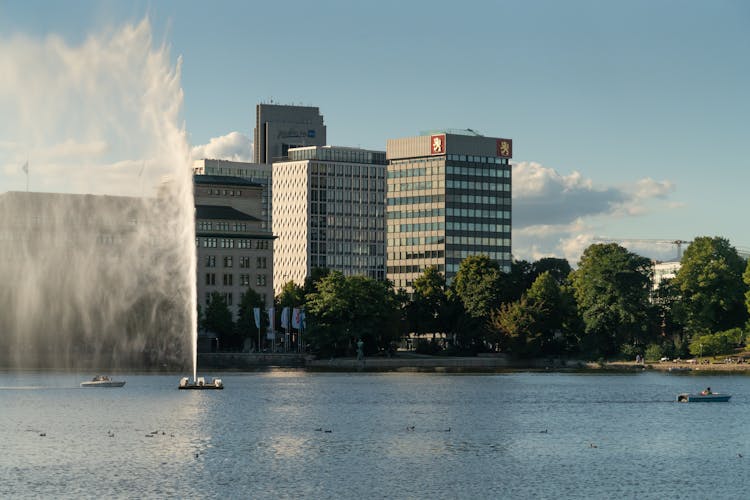 Calm River In City With Fountain