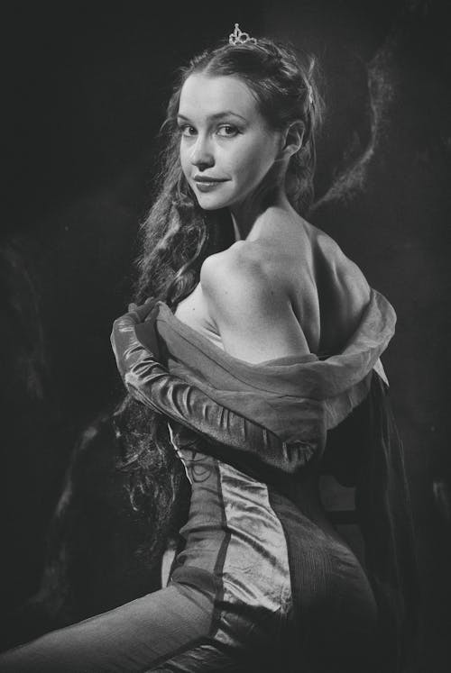 Grayscale Photo of a Woman in Off Shoulder Dress