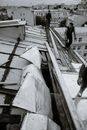 Builders mending old weathered roof in town
