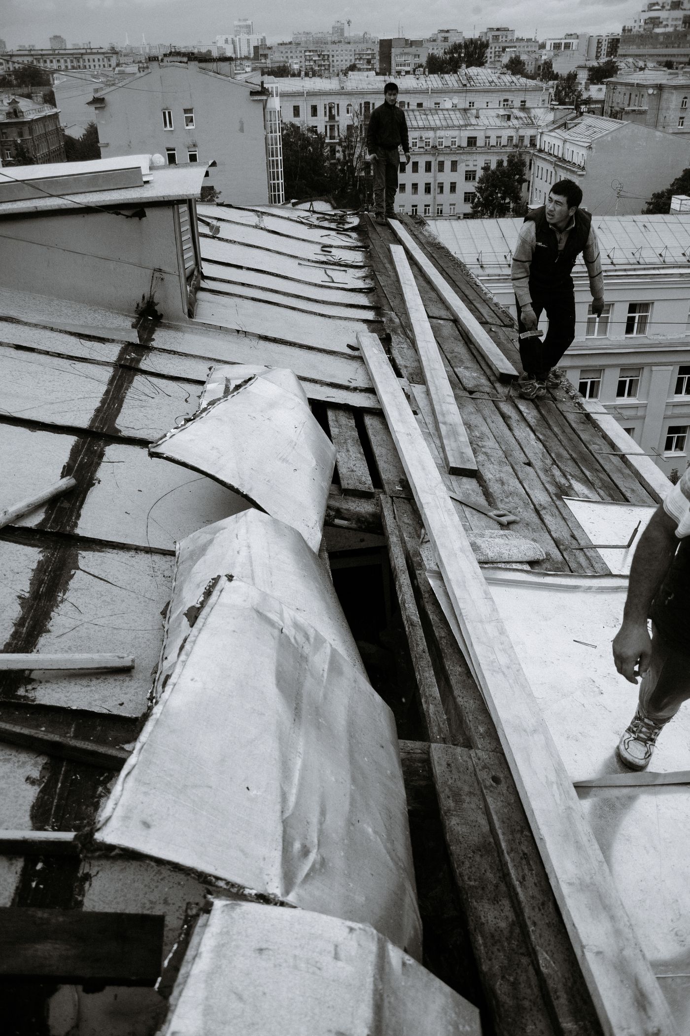 Workers carrying out roof maintenance