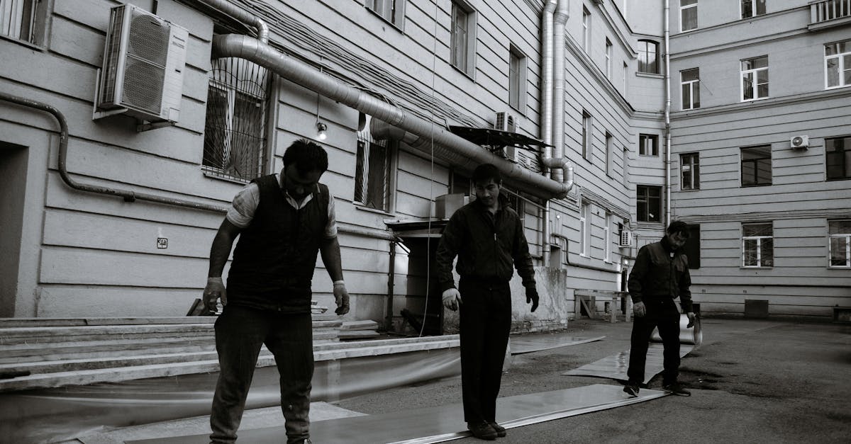 Man Scaling the Roof as He Inspects