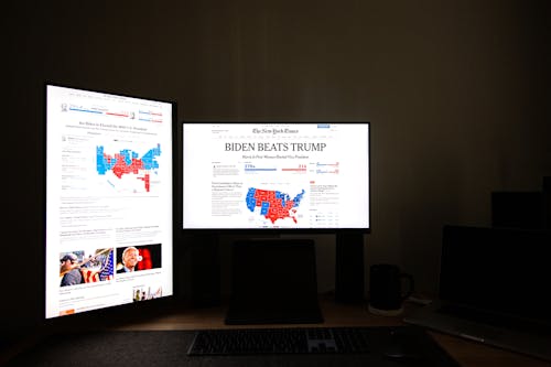 Free Black Flat Screen Computer Monitor with Headline News on Display Stock Photo