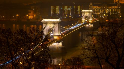 Free Captivating night view of the Széchenyi Chain Bridge illuminated over the Danube River in Budapest. Stock Photo
