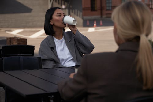 Free A Woman Sitting at the Table Stock Photo