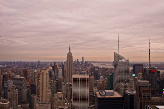 A breathtaking view of the New York City skyline with the Empire State Building at dawn. Captivating urban scene.
