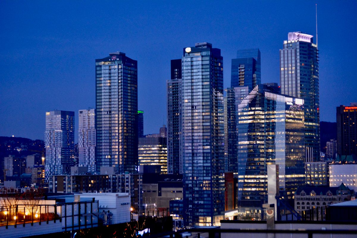 Illuminated skyscrapers of a financial district at dusk