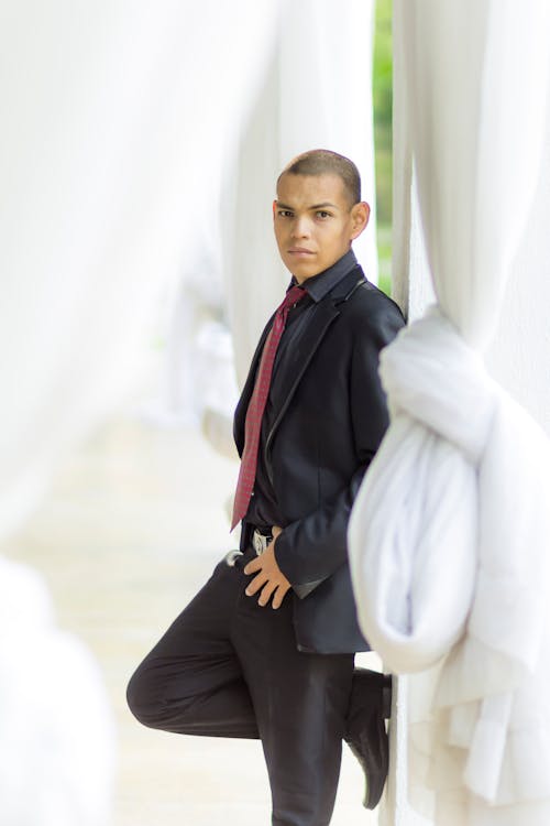 Portrait of Man in Suit Posing in White Interior