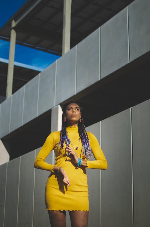 African American woman standing near building