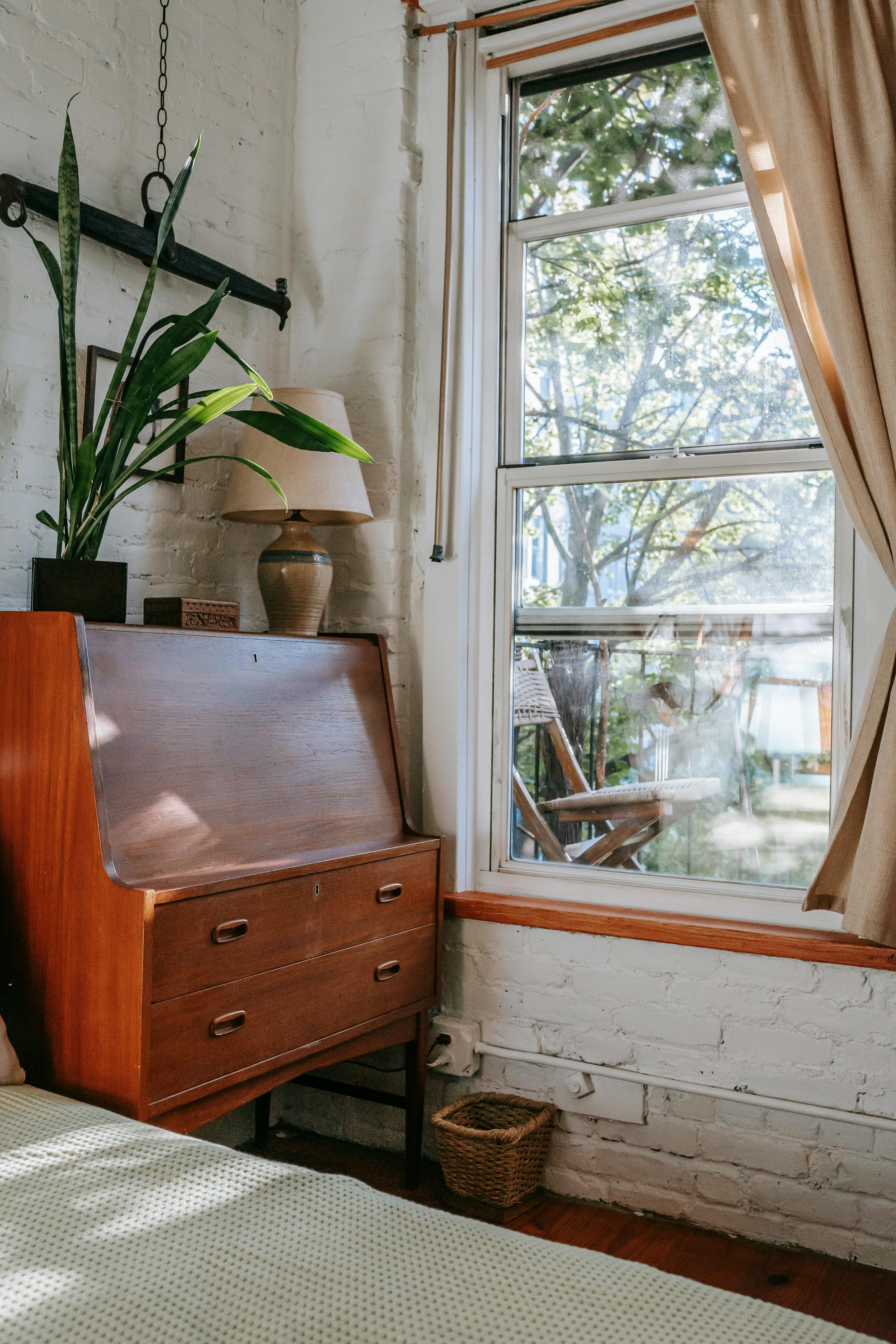 cozy room with retro cabinet near window