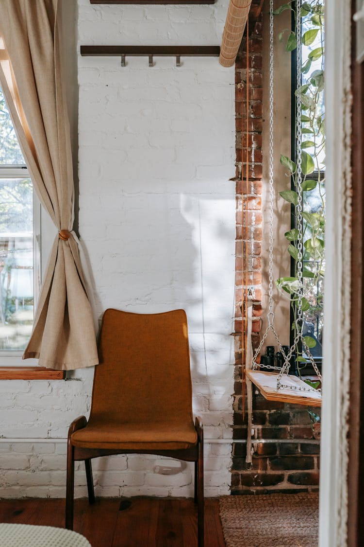 Light Living Room With Rustic Chair And Indoor Swings