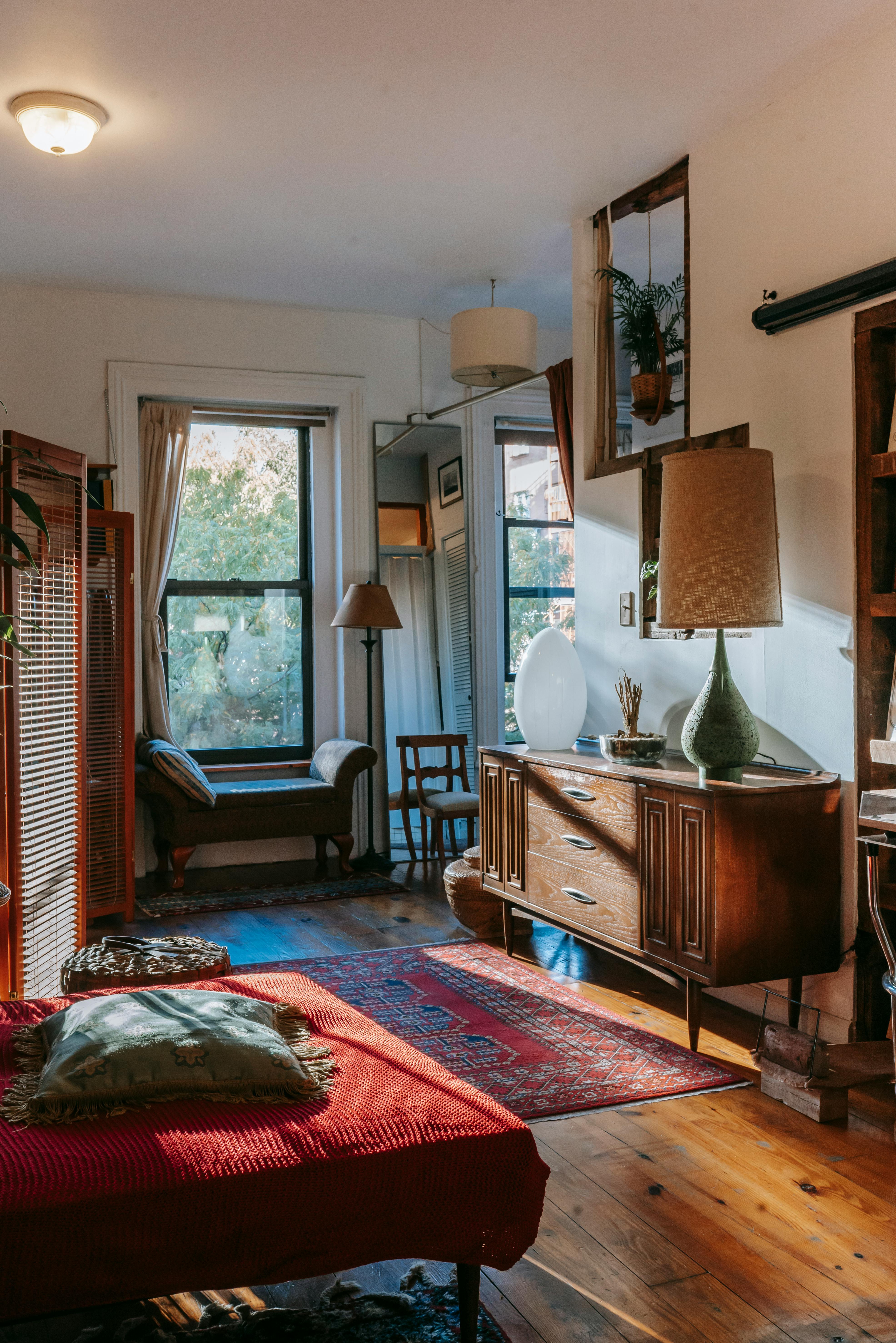 cozy bedroom interior with antique wooden furniture and stylish decorative elements