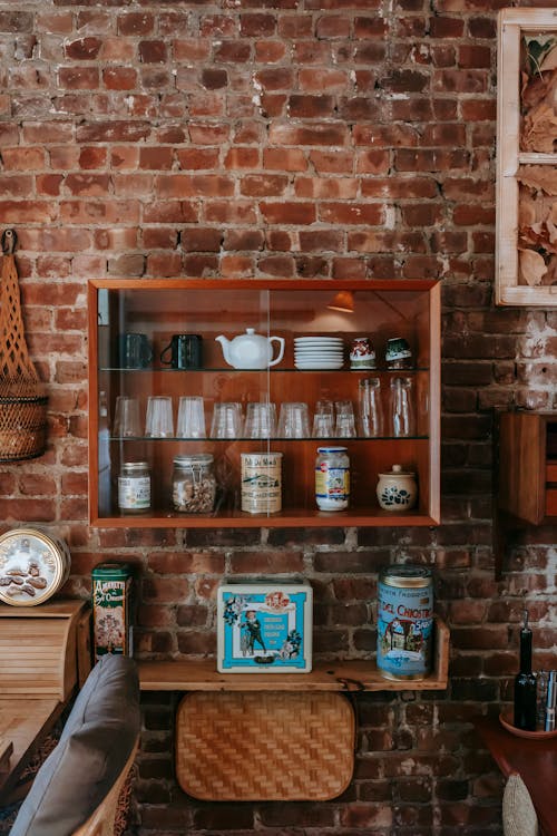 Interior of vintage kitchen with classic wooden furniture and dishware