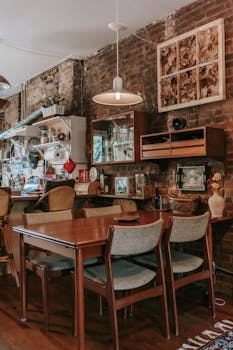 Warm and inviting kitchen interior with vintage decor and brick wall.