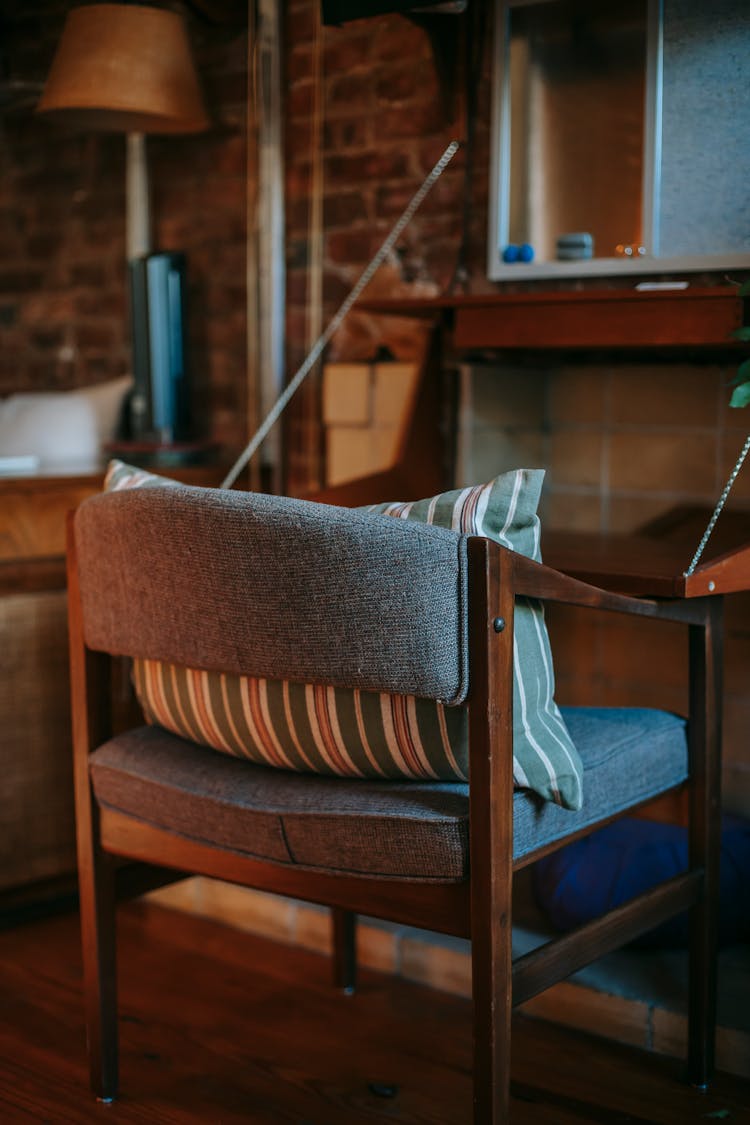 Old Wooden Chair With Pillow In Room