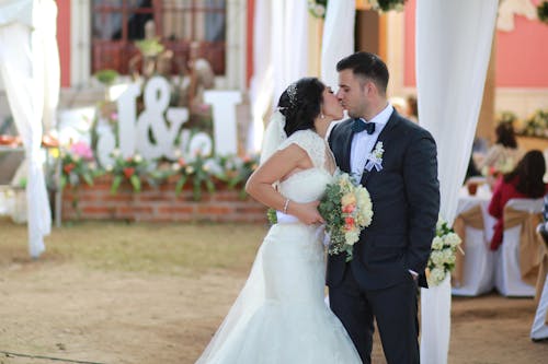 Bride and Groom Kissing at Wedding