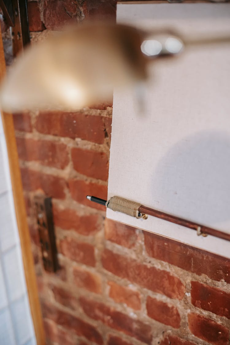 Clear White Paper Placed On Brick Wall