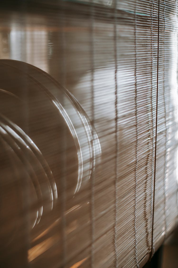 Plates Placed Behind Curtain In Apartment