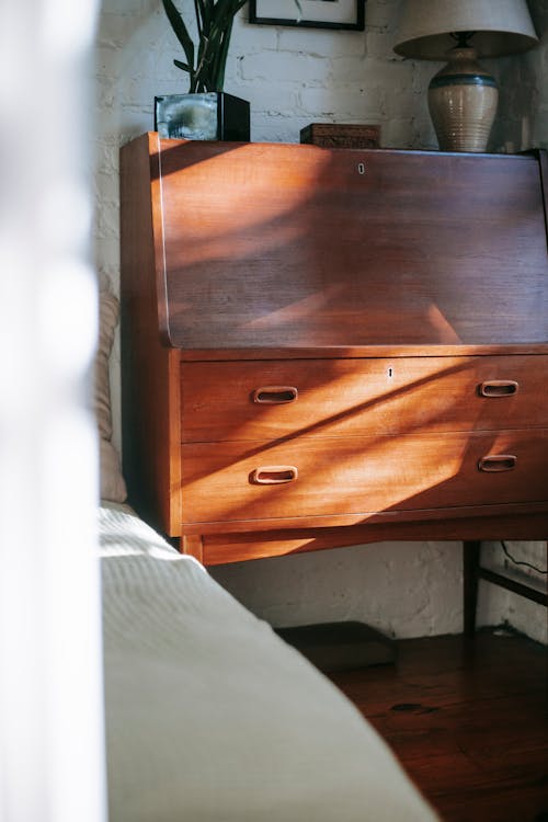 Stylish retro wooden dresser in room