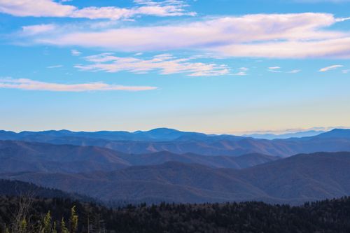 Free Beautiful mountain landscape with a clear blue sky and scattered clouds. Stock Photo