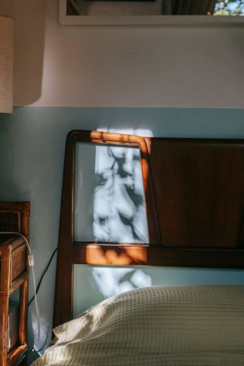 Vintage bed and nightstand in room