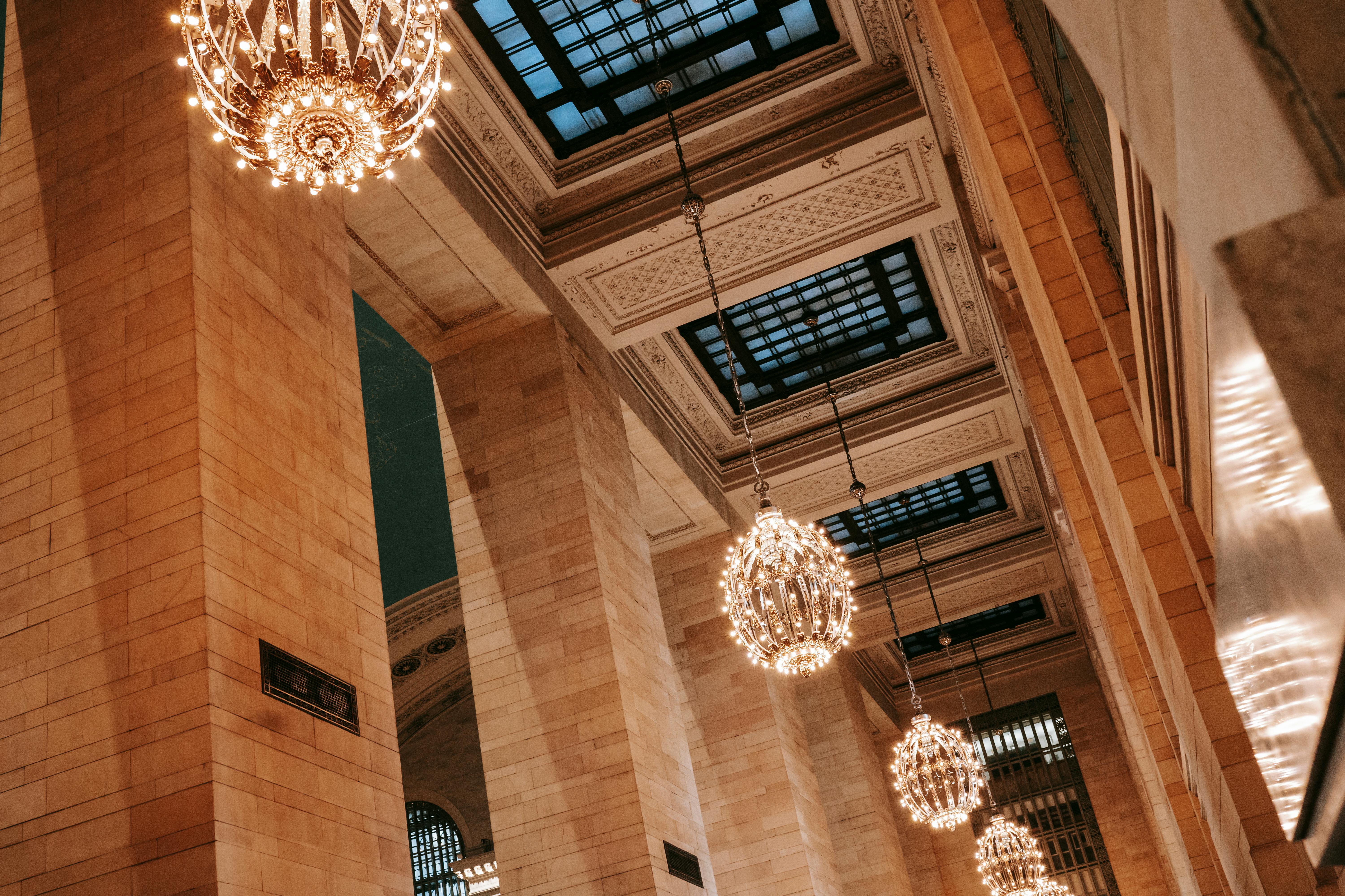 ornamental ceiling with windows and chandeliers