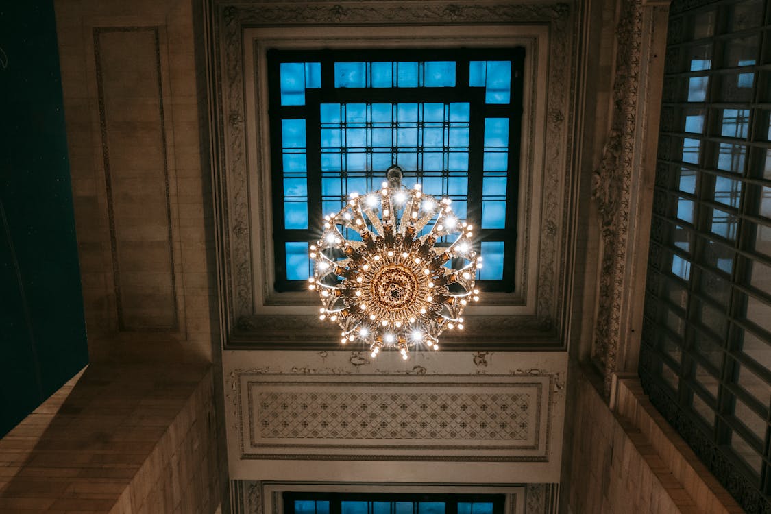 Free Classic ceiling with majestic chandelier on window Stock Photo