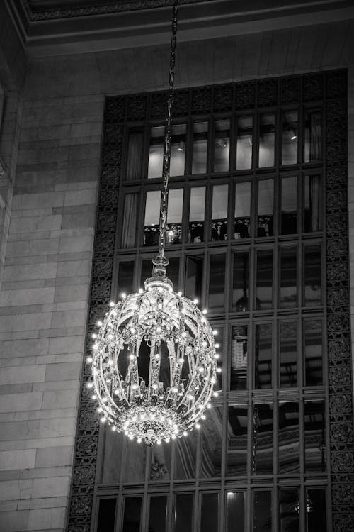 Free Majestic chandelier on ceiling near window Stock Photo