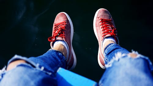 Person Wearing Pair of Red Low-top Sneakers