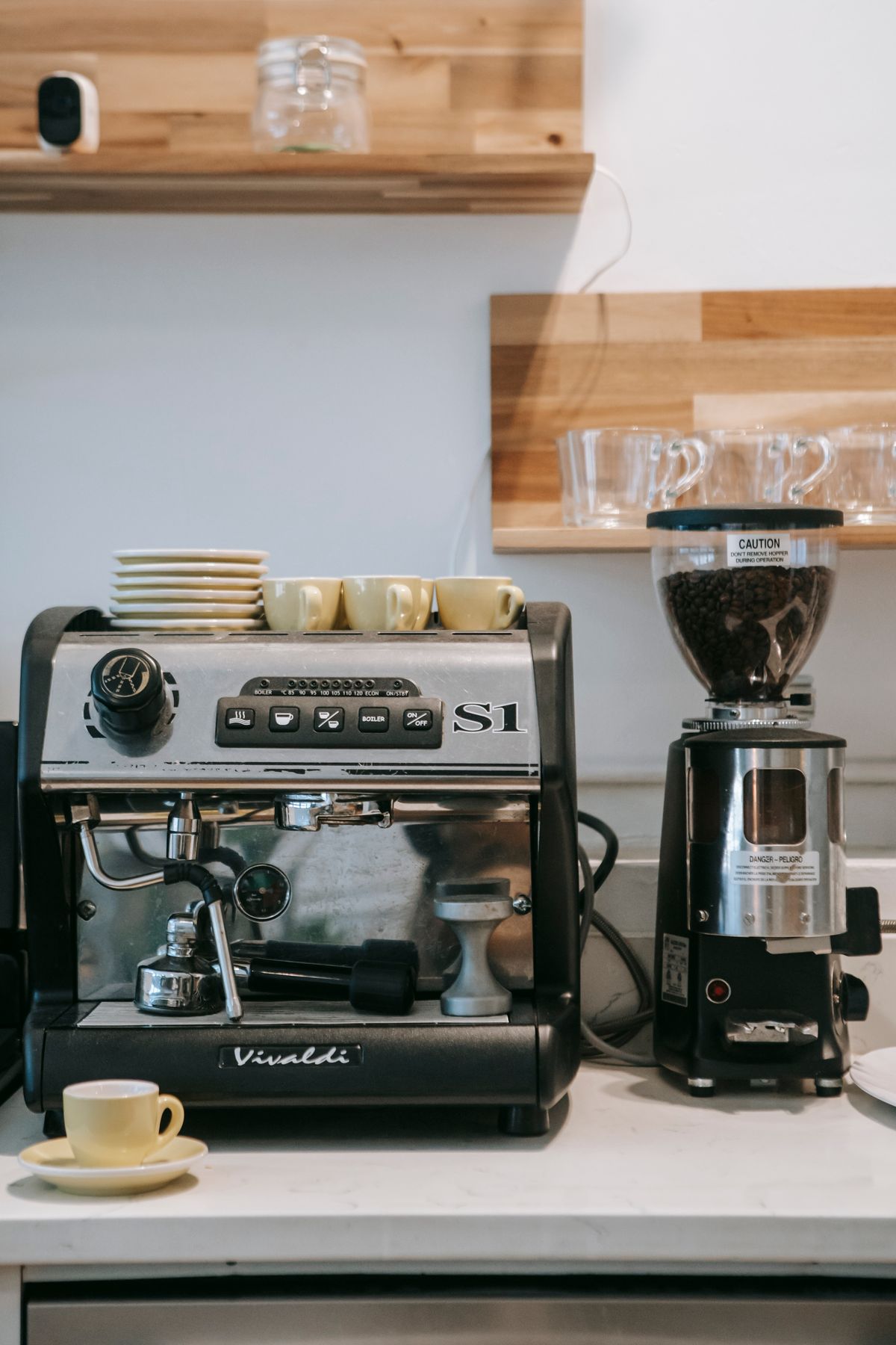 Espresso machine and grinder set up on a kitchen counter