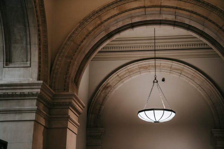 Arched Passage With Chandelier In Grand Palace