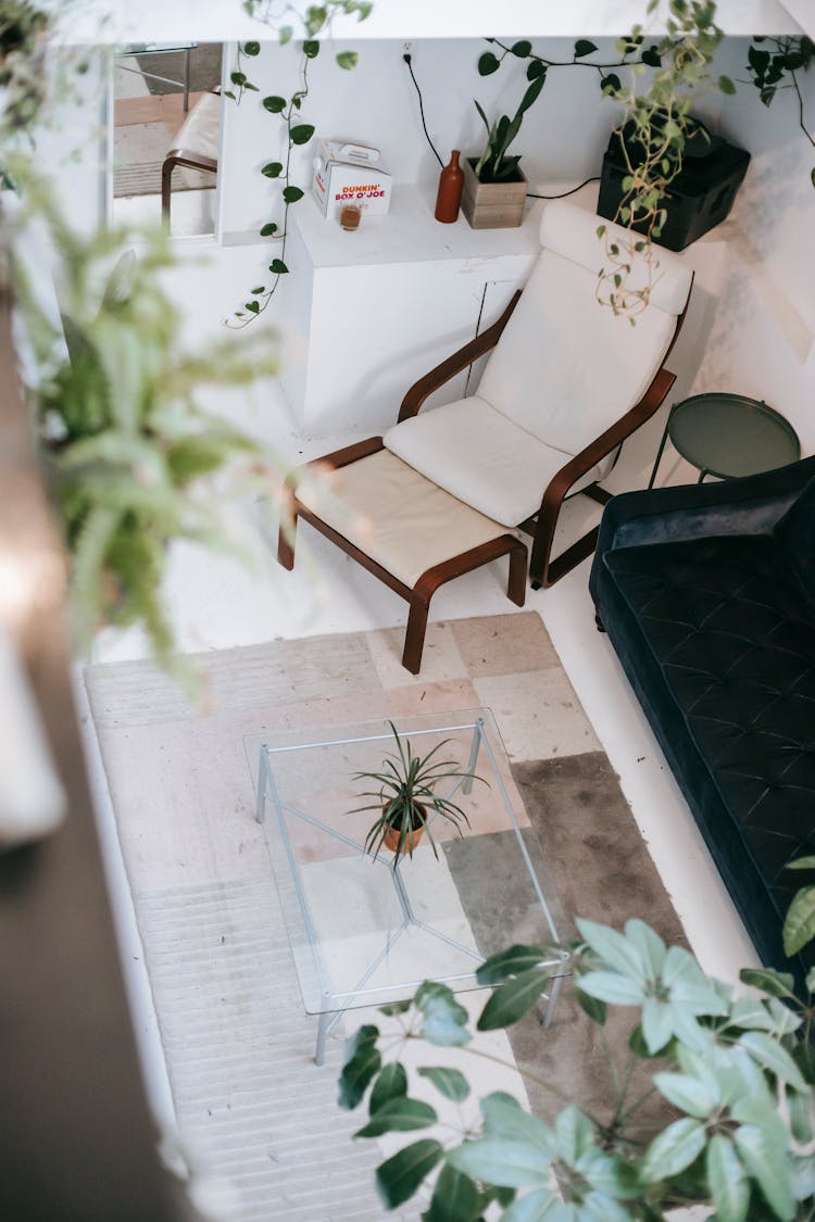 Living Room Interior With Furniture On Tiled Floor