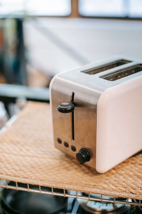 From above of contemporary electric appliance for making toast on kitchen in daylight