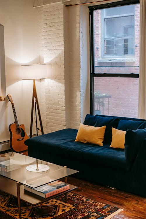 Sofa with cushions in living room