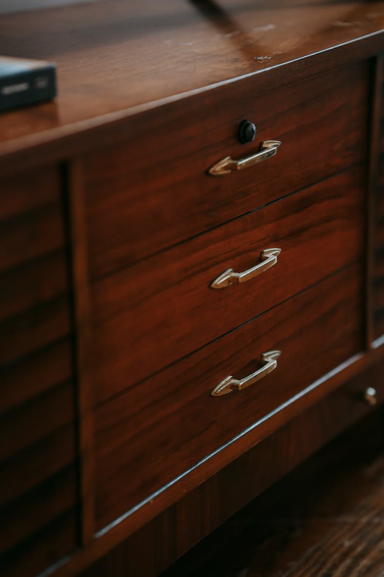 Wooden Dresser With Handles In Room